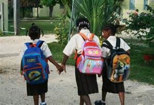 Three children walk to school together.