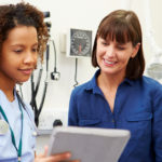 Doctor and patient review health notes