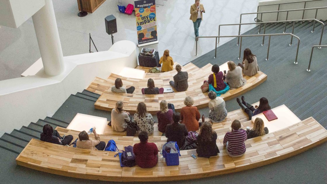 students at a conference presentation